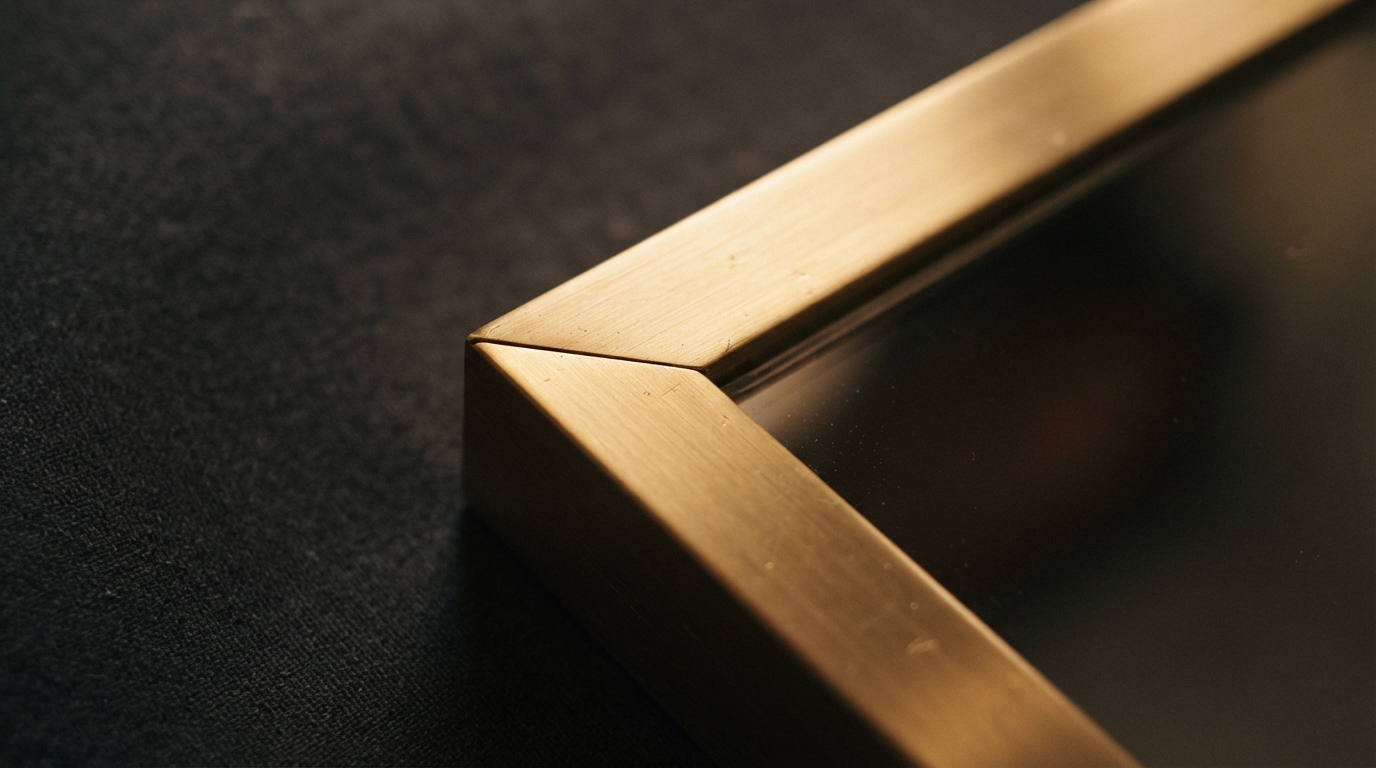 Brushed gold mirror frame corner joint detail
